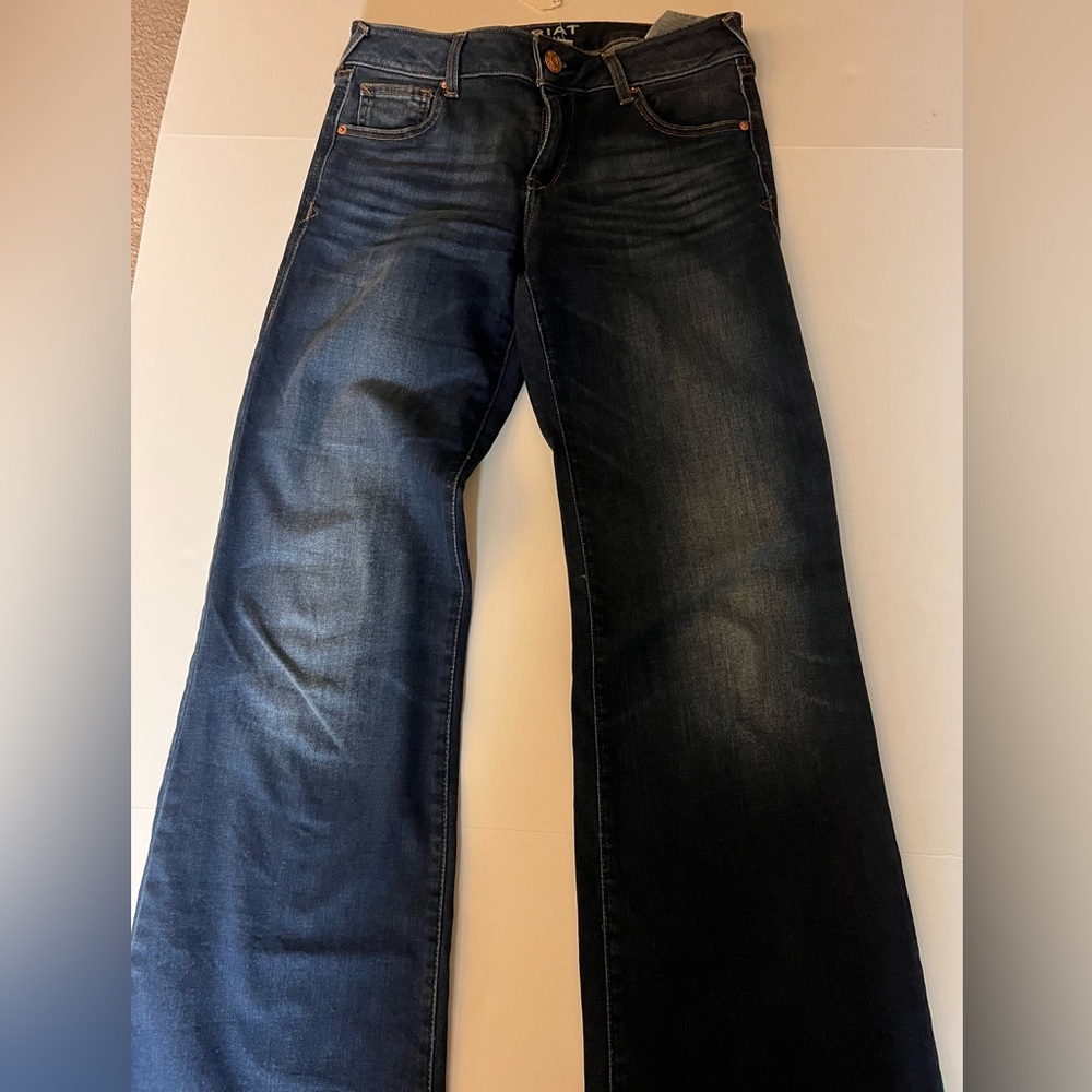 Ariat woman’s jeans size 28R boot cut, high rise medium wash blue denim.